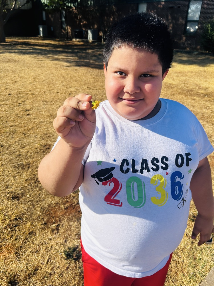 A flower for his teacher, Mrs. Ambrose!