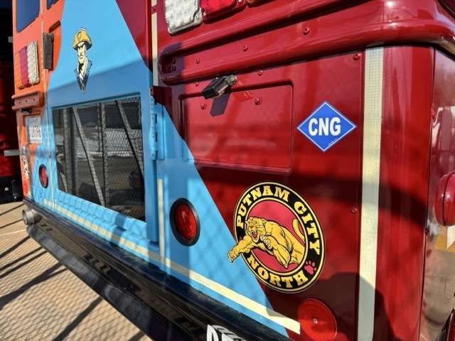 BACK OF BUS WITH A CNG STICKER