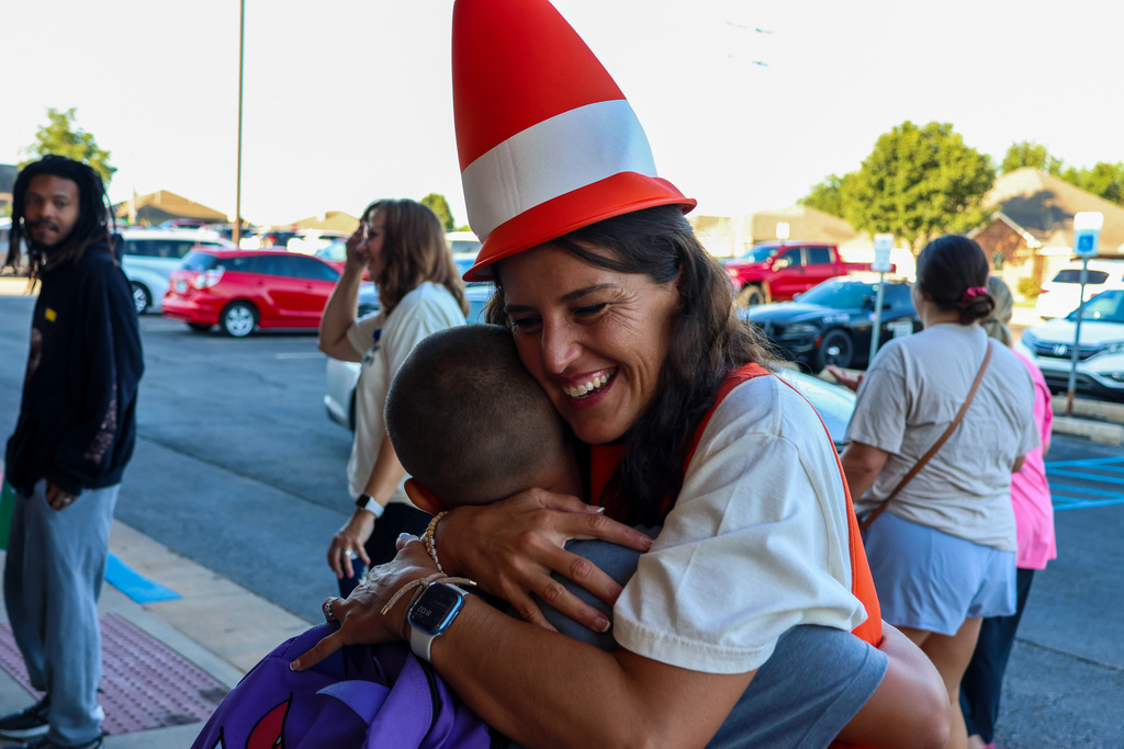 teacher hugging student