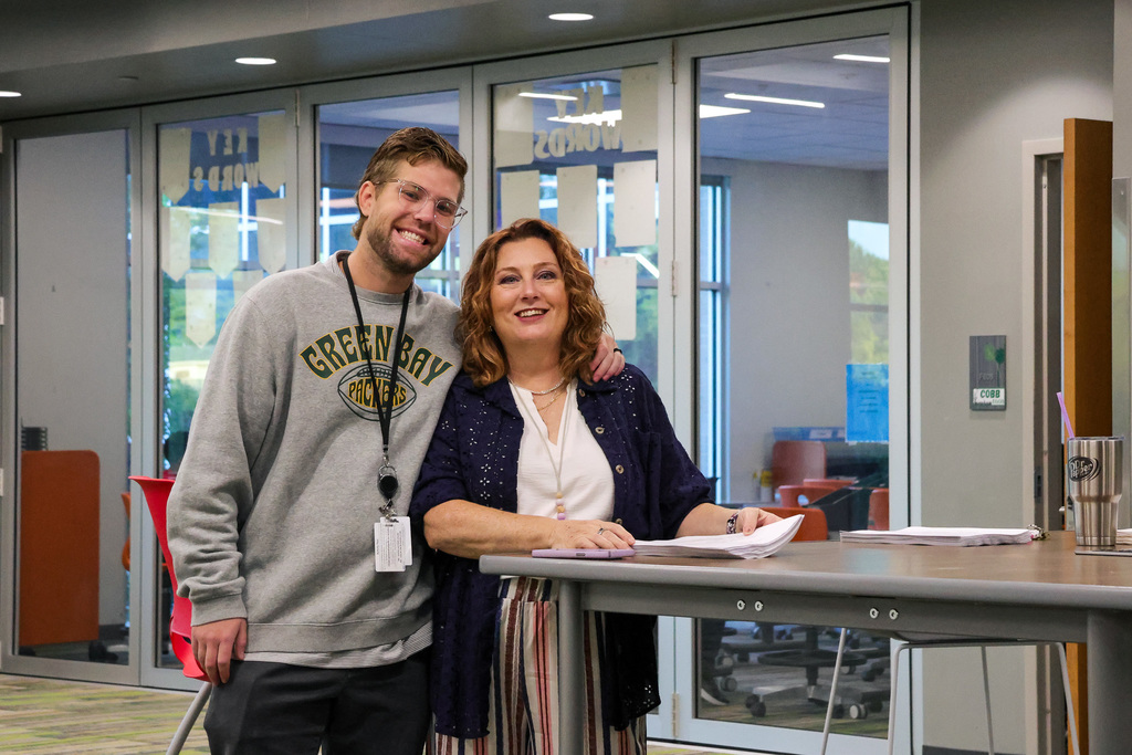 two teachers smiling