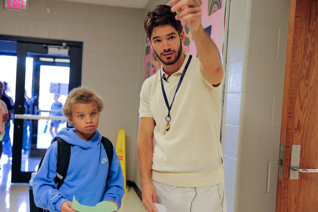teacher helping student