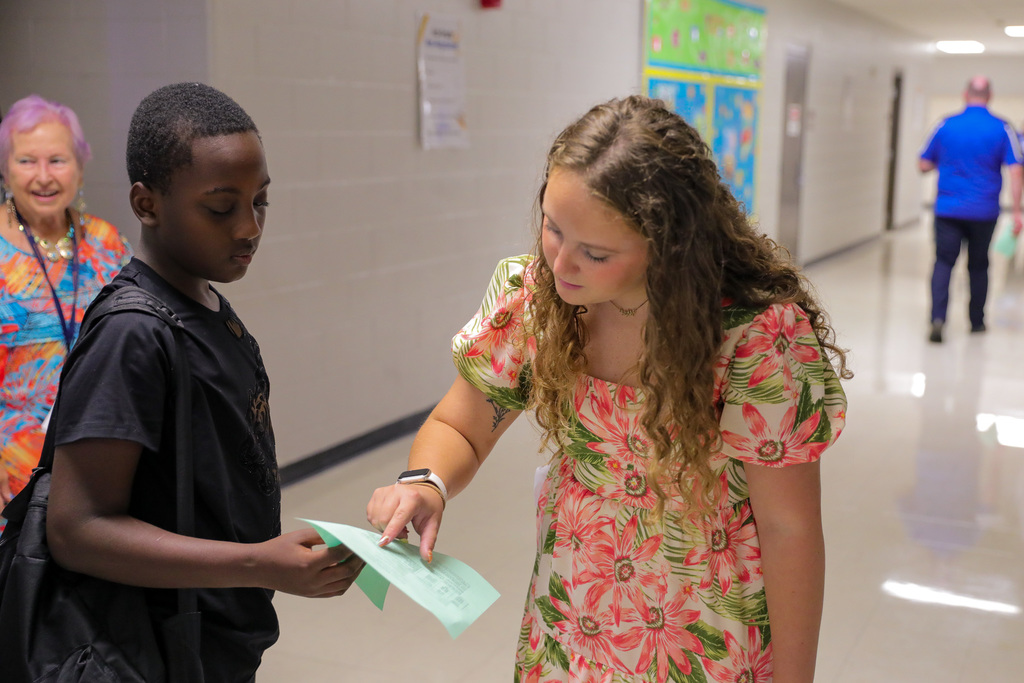 teacher helping student