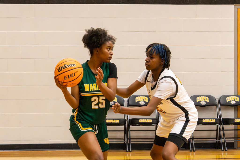 Western Oaks player guarded closely by Cooper player