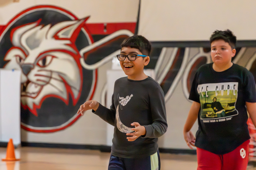 smiling student waiting for a pass