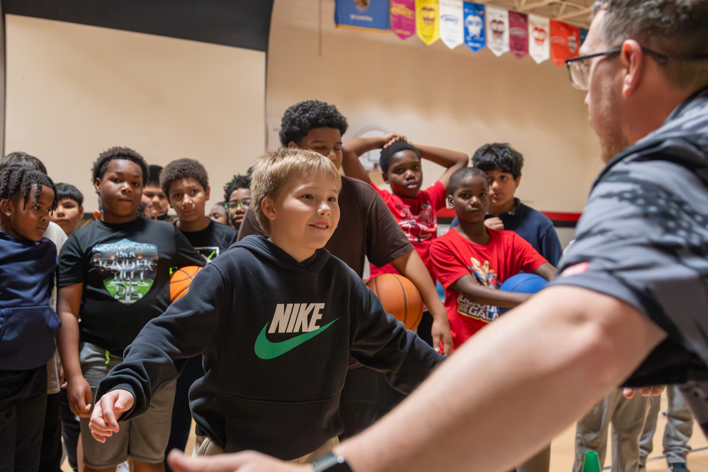 student in defensive stance