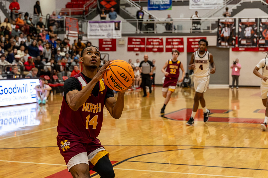 PCN Boys Basketball player shoots a shot during the semi-final round