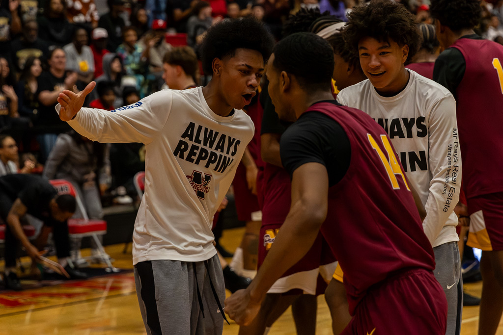 PCN Boys Basketball players high five during the semi-final round