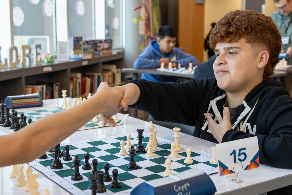 Opponents shaking hands after checkmate