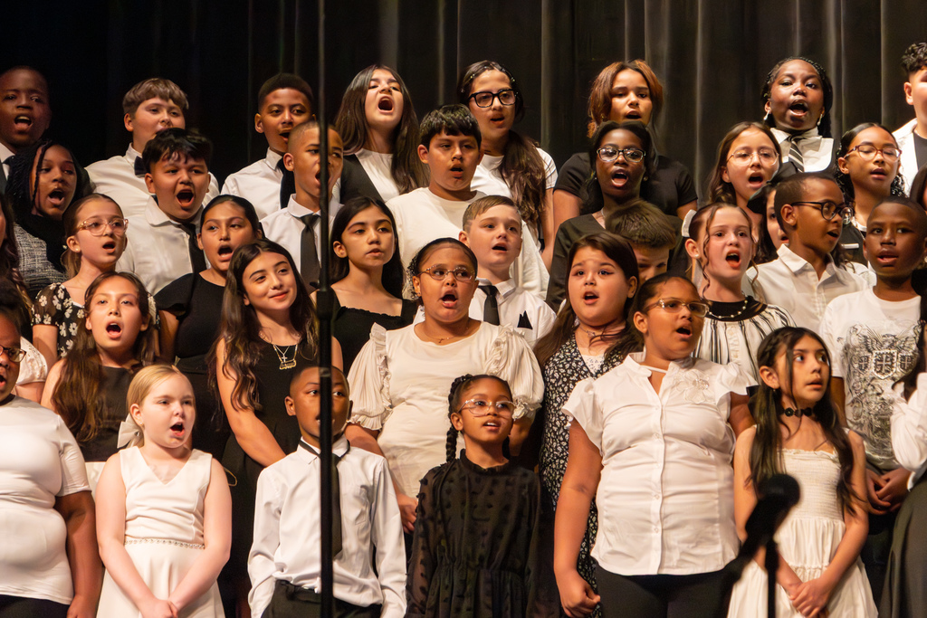 elementary school choir performing on stage