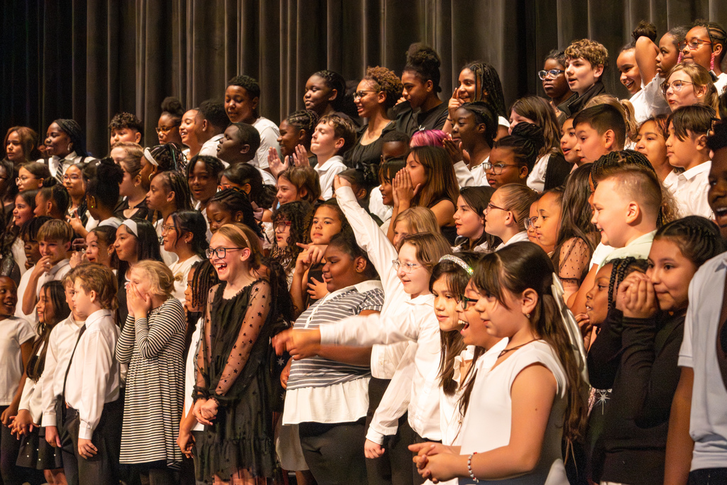 elementary school choir performing on stage