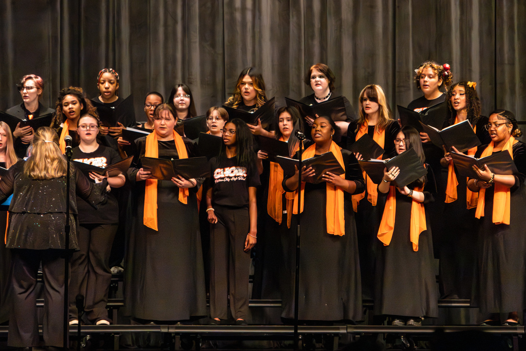 high school choir performing on stage