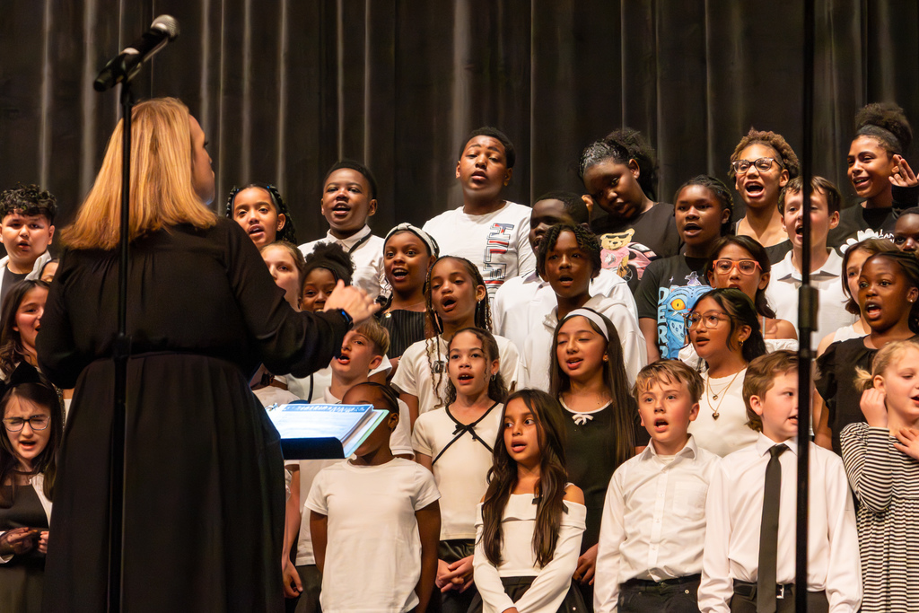 elementary school choir performing on stage