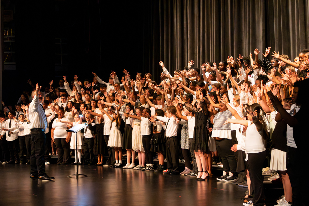 elementary school choir performing on stage