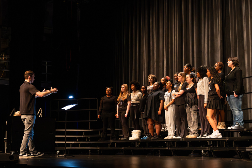 middle school choir performing on stage