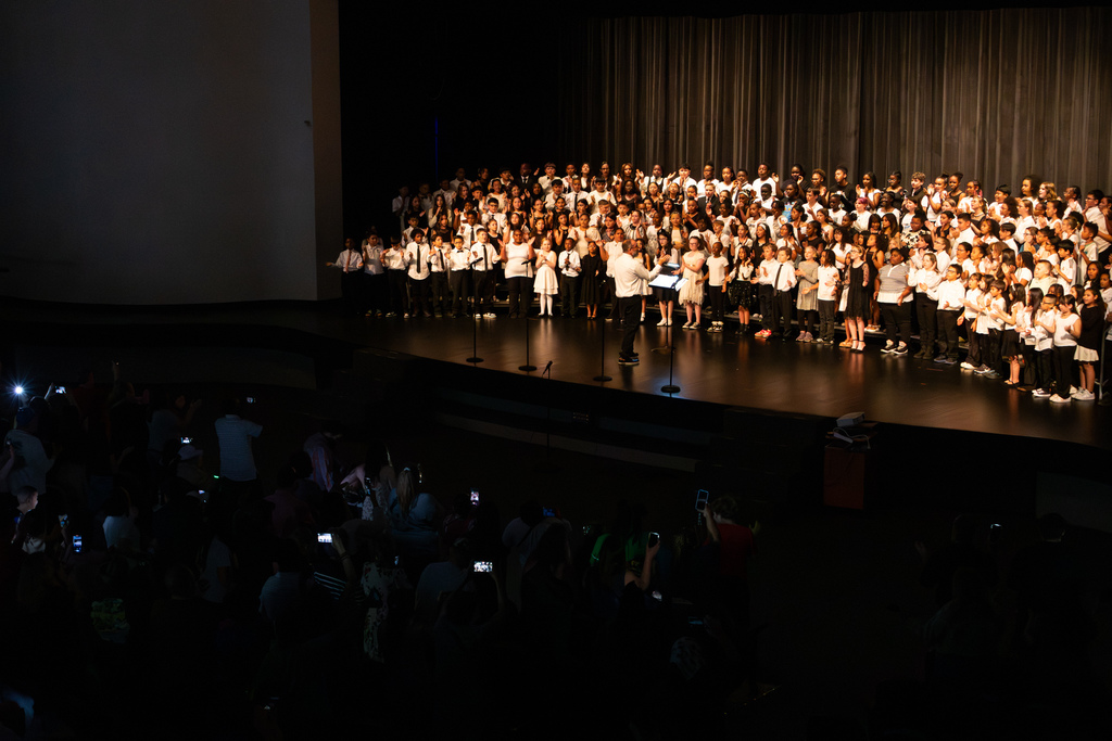 elementary school choir performing on stage