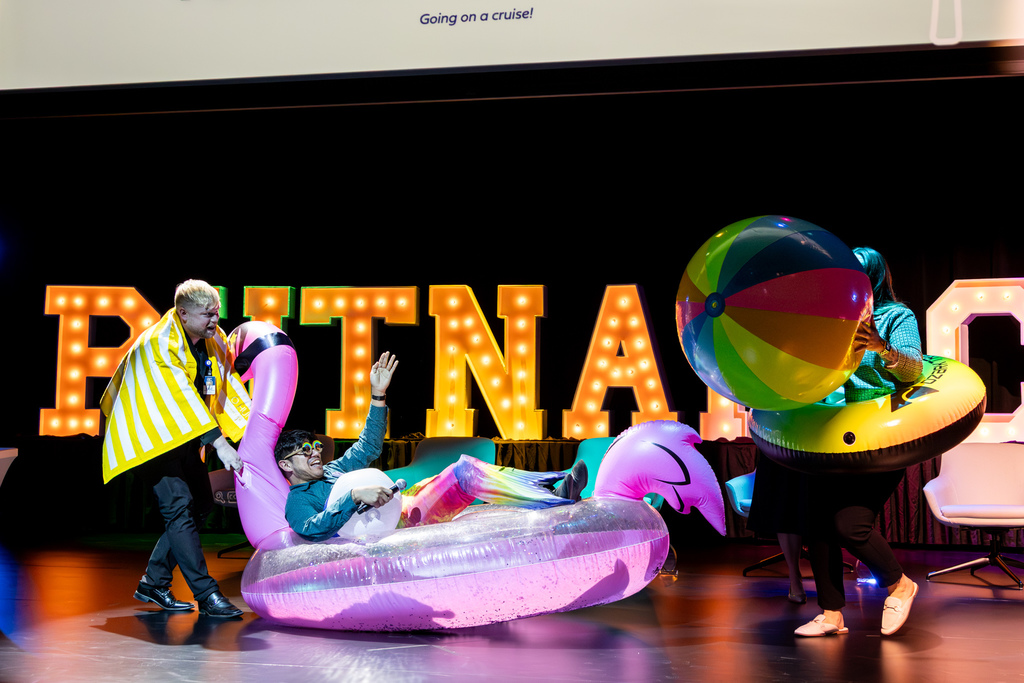a man in a mermaid costume sitting in a pool float