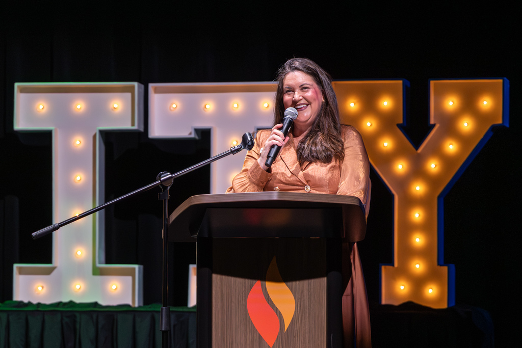 Woman speaking at a podium