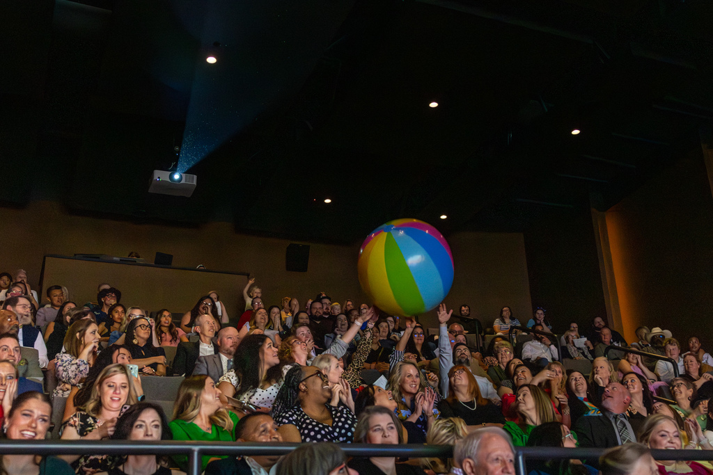 a beach ball being tossed in an audience