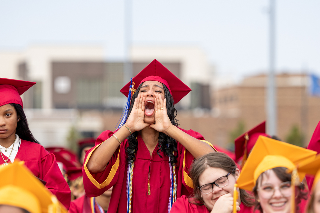 A Putnam City North graduate calls out to the crowd during the graduation ceremony.