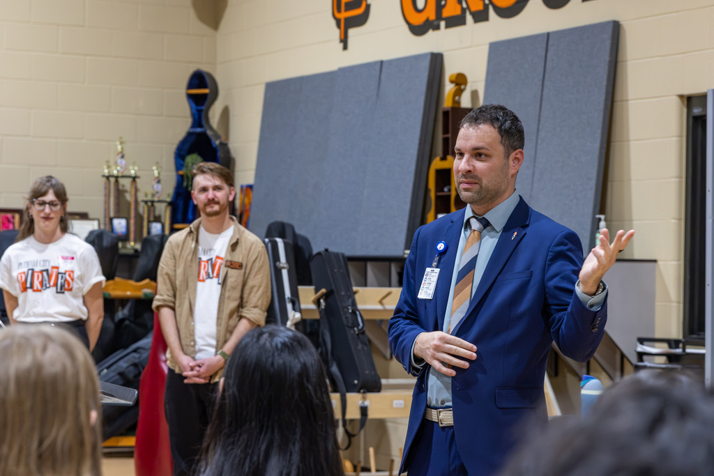 Putnam City Schools Chief Communications Officer AJ Graffeo speaks to Putnam City High School Symphony Orchestra students during the celebration of their OkMEA honor.