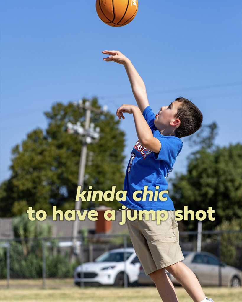 A student shoots a basketball toward the hoop during recess. Text reads, “kinda chic to have a jump shot.”