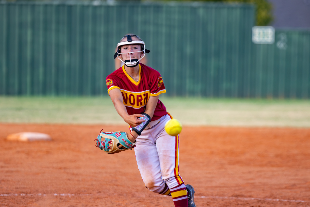 A PC North pitcher releases a softball toward home plate during the game.
