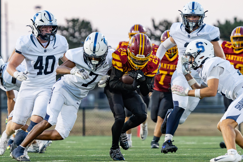 PC North defenders converge to tackle a Shawnee ball carrier during the game.