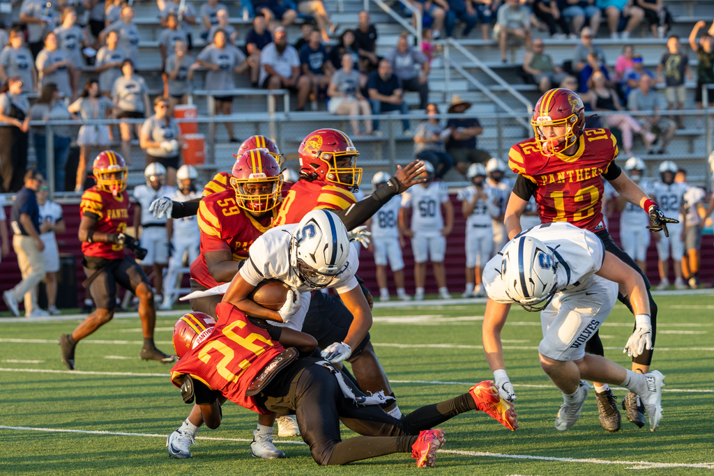 PC North defenders converge to tackle a Shawnee ball carrier during the game.