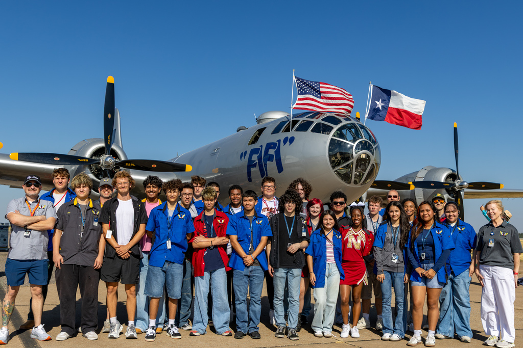 Putnam City Aviation students and staff pose together in front of the B-29 FIFI.