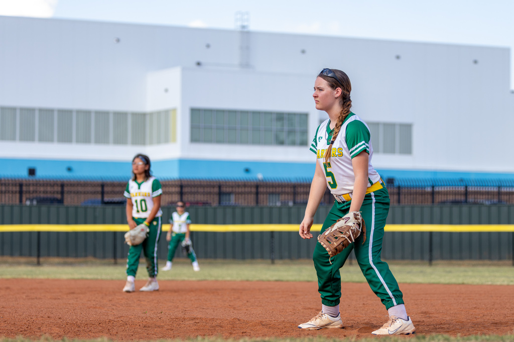A Western Oaks infielder stands ready on the dirt during the game against Mayfield Middle School.