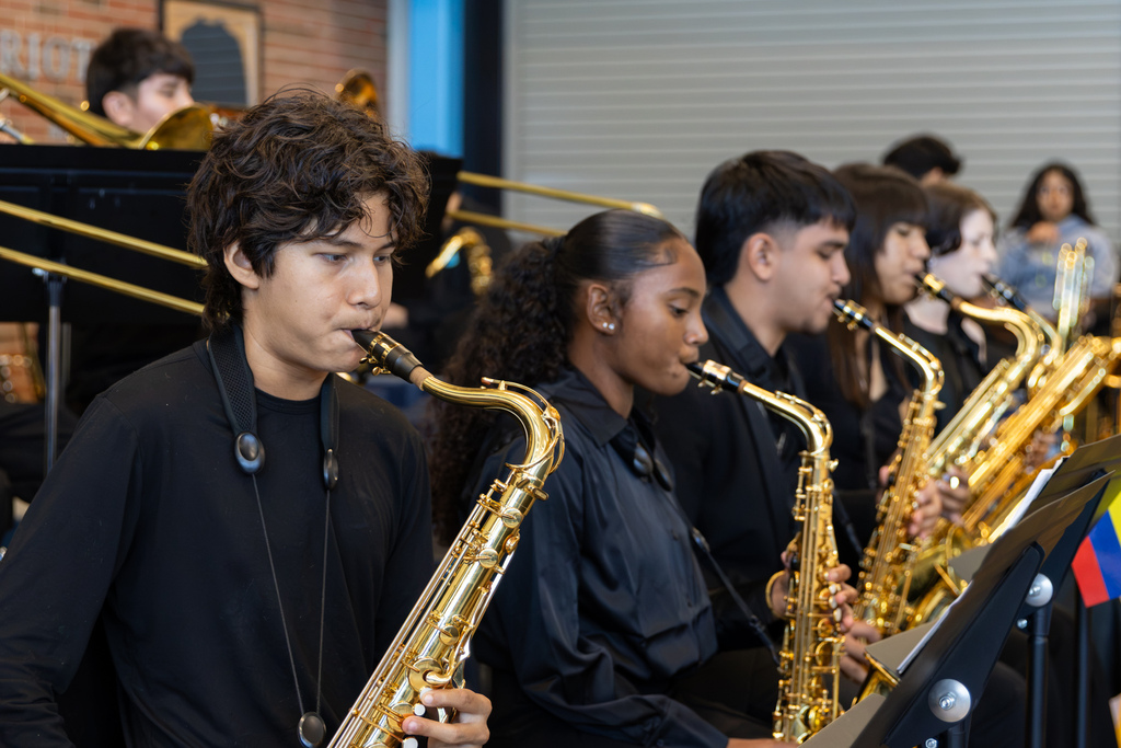 Putnam City West band students perform on saxophones during the Hispanic Heritage Month Living Museum.