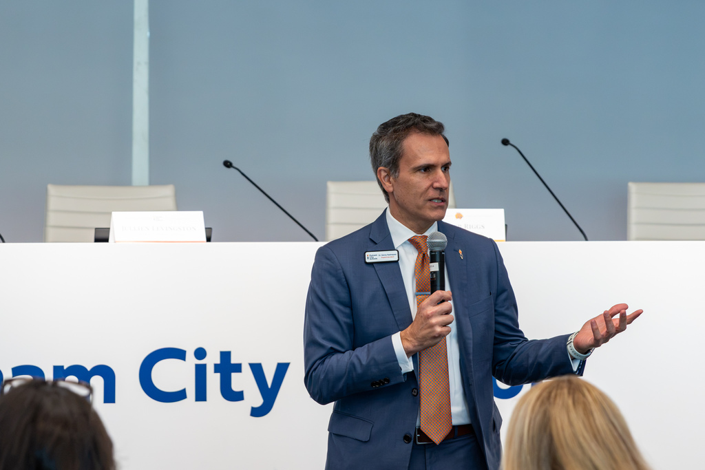 Putnam City Schools Superintendent Dr. Kenny Rodrequez speaks at a microphone in front of an audience gathered at the PC Centennial Center.