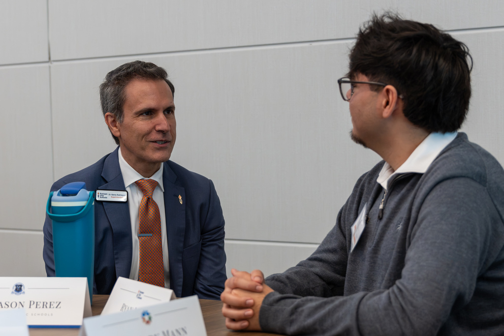 Superintendent Dr. Kenny Rodrequez speaks with a student panelist.