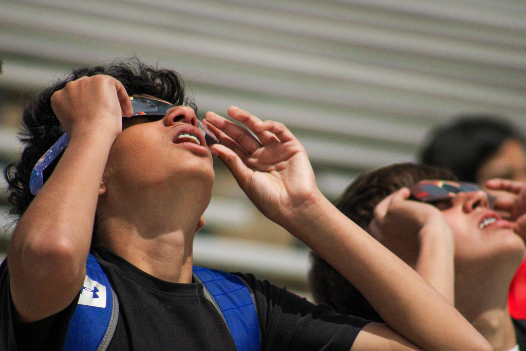 kids looking at solar eclipse