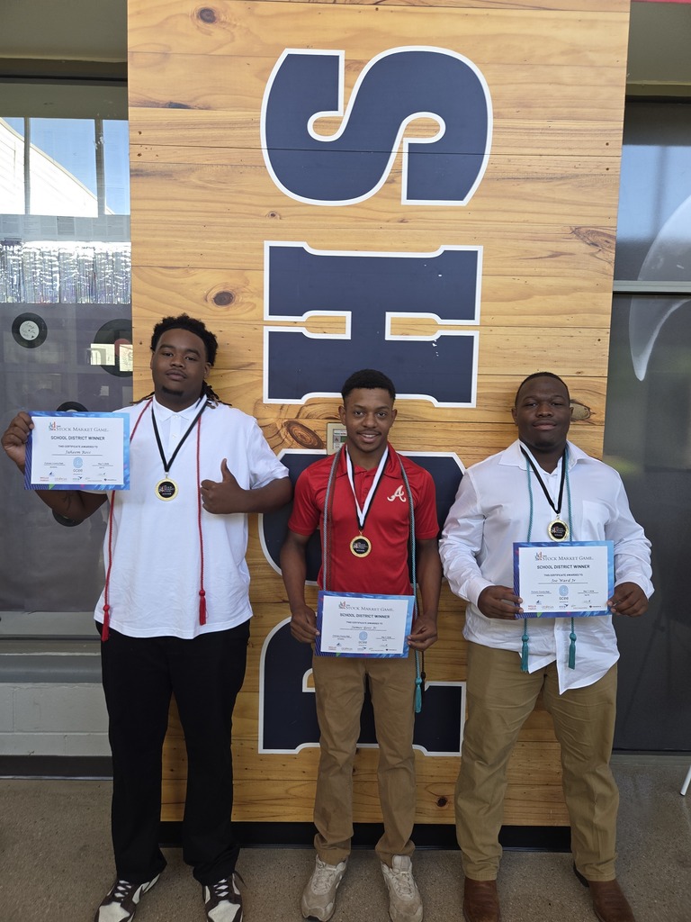 Stock Market Game District Winners: Jaheem Ross, James Goss, and Joe Ward are pictured.