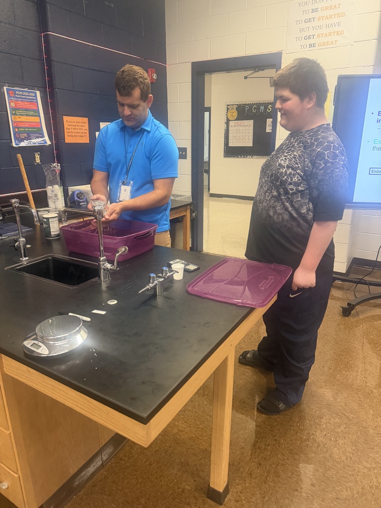 Mr. Abney and student conducting experiment