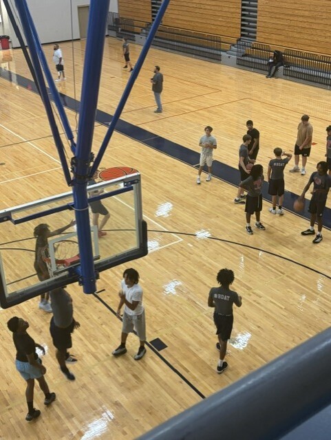 Students in gym playing ball and exercising