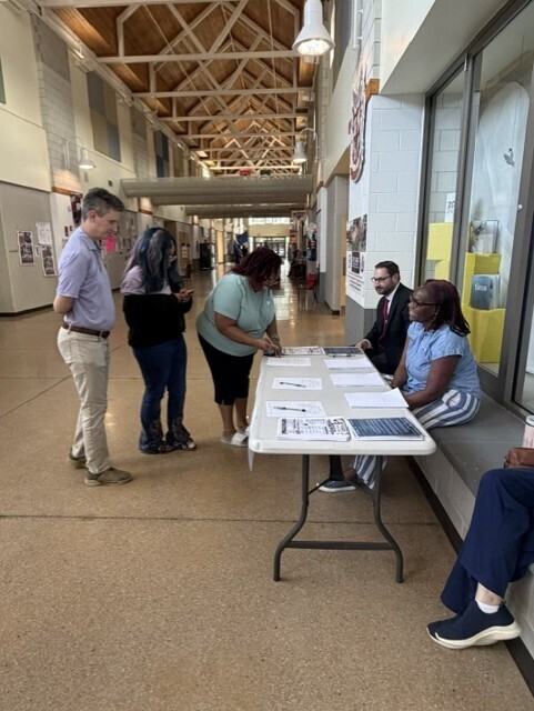 family at registration table