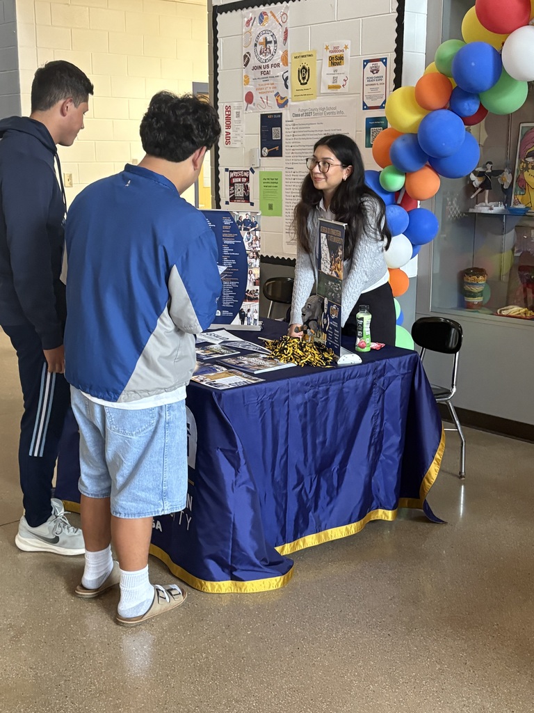 Students discussing Georgia SouthWestern with admission rep.