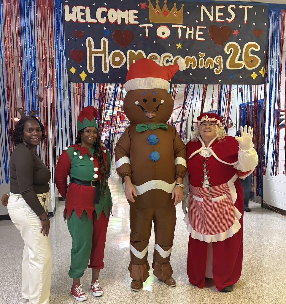 Mr. Patrick and the counselors dressed in Christmas attire.