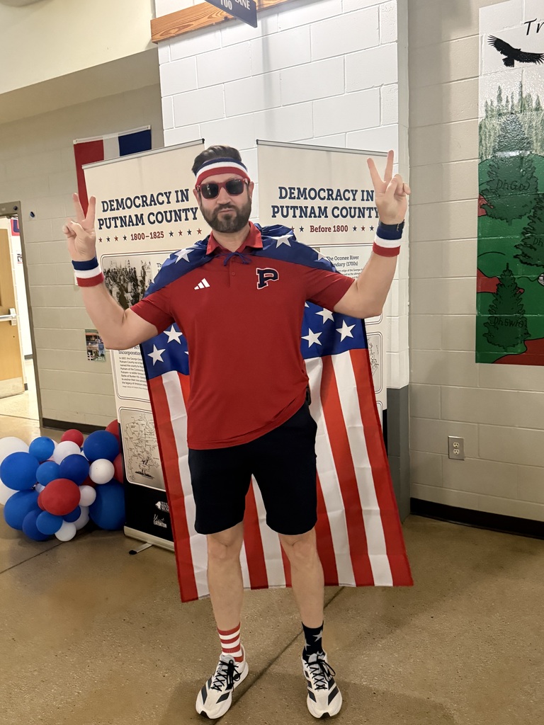 Mr. Patrick dressed in Red, White, & Blue.  Including the American Flag.