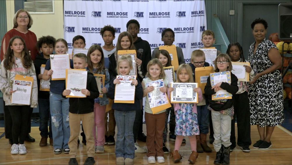 picture of 18 students who were Terrific Kid with both principal and assistant principal