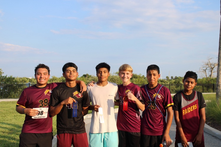 boys cross country team poses for picture.