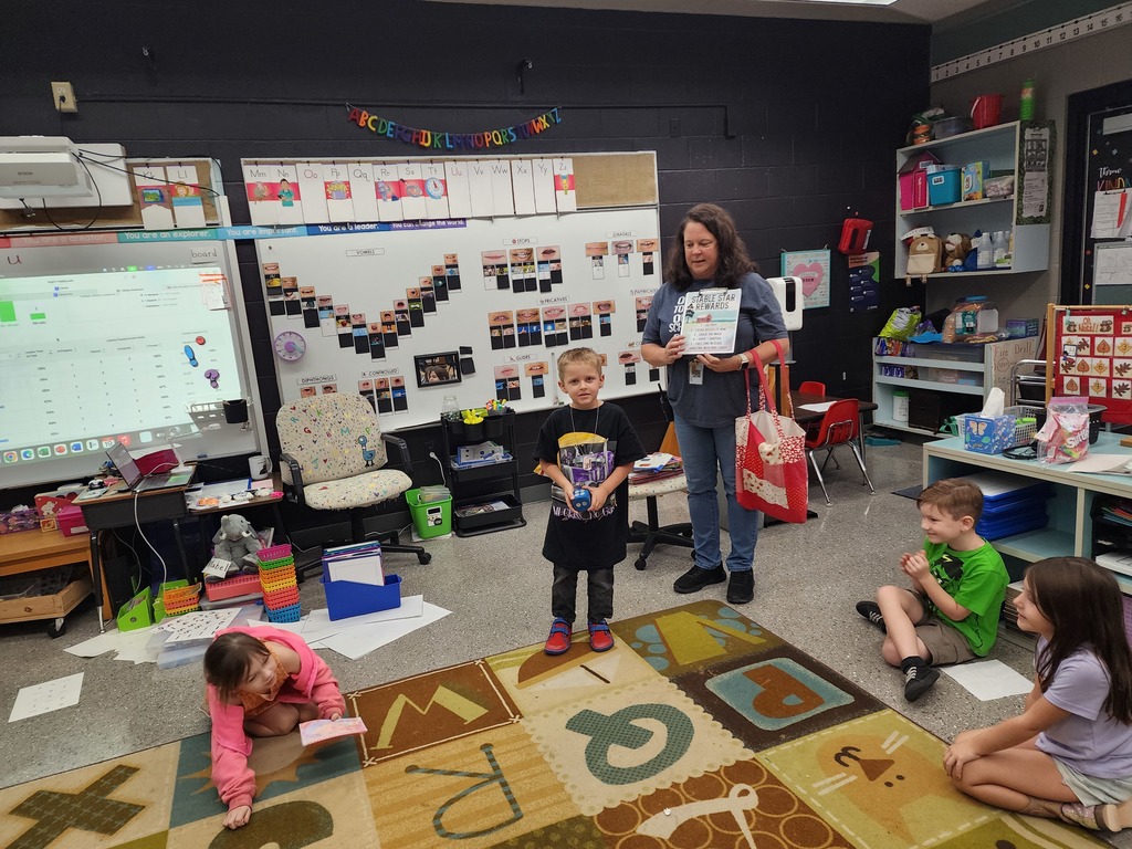 Students rolling dice for earning stars. 