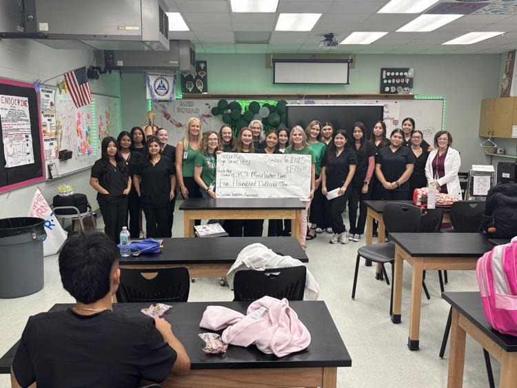 A picture of our Allied Health/HOSA Program with our PCSD Mental Health Counselors Department posing for a picture as a donation was provided to Mrs. Simmons and her team.
