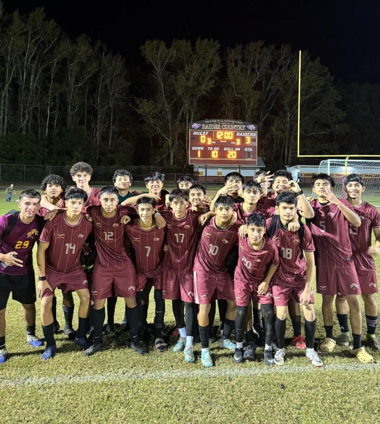 picture of men’s Raider soccer team with scoreboard depicting score of 3-0. raiders win!
