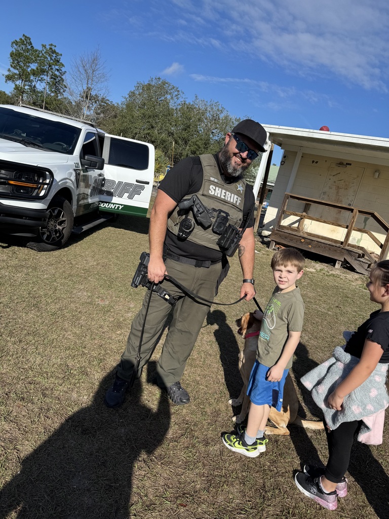 deputy with dog and child