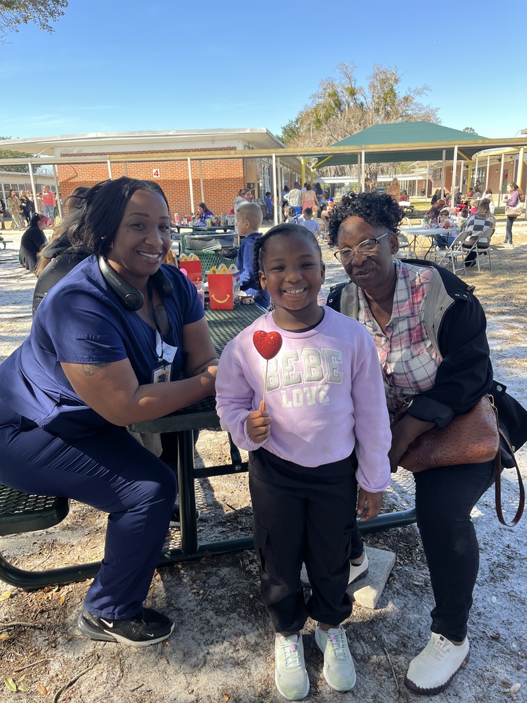 Picture of student with mom and motherly figure