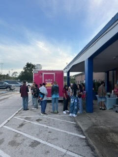 Seniors being served snacks. 