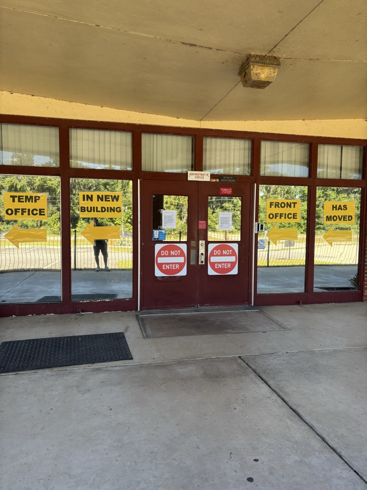 Picture 1: The office has moved to a new temporary location. Look for the large billboard of signs, that’s where we are located now.